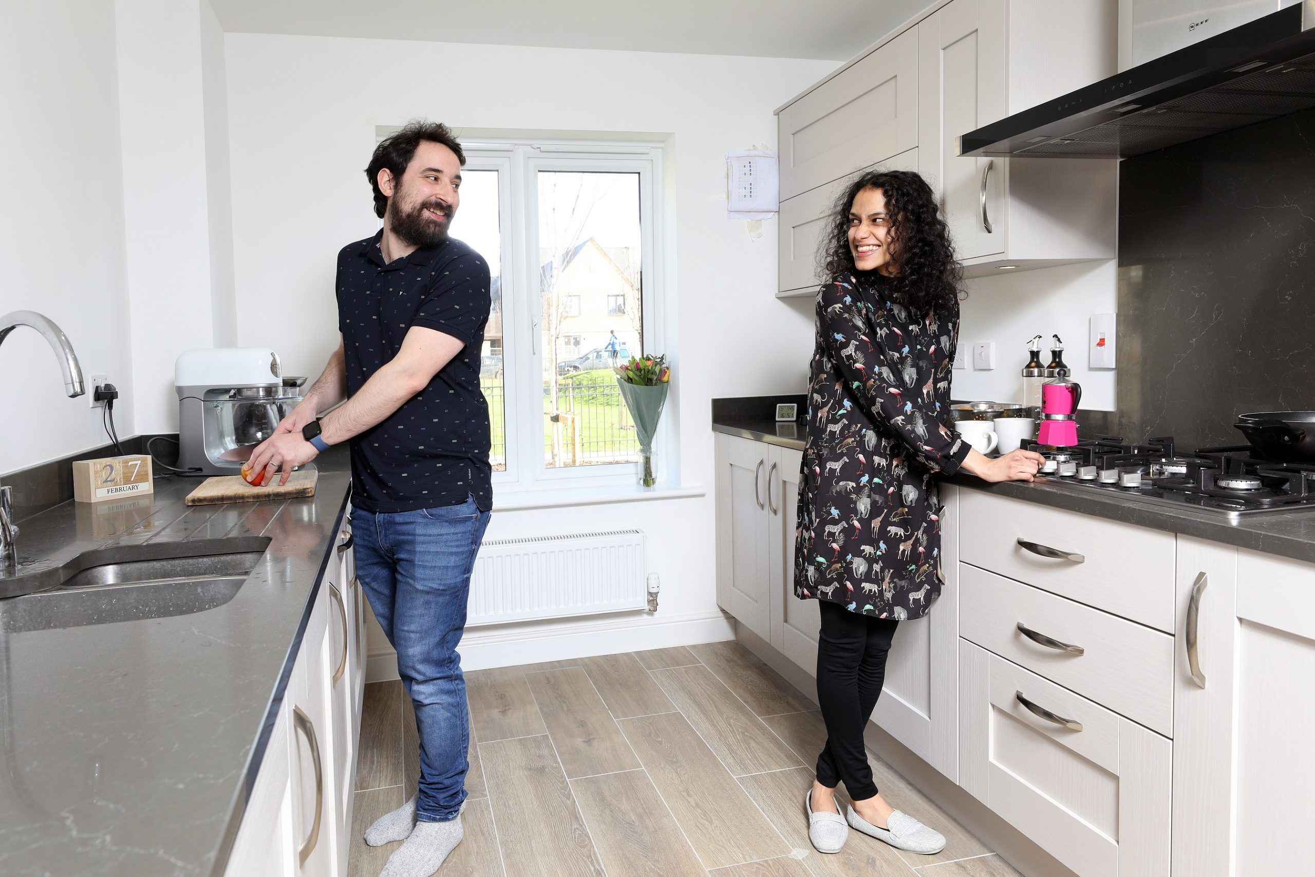 Couple in their kitchen at Wintringham St Neots