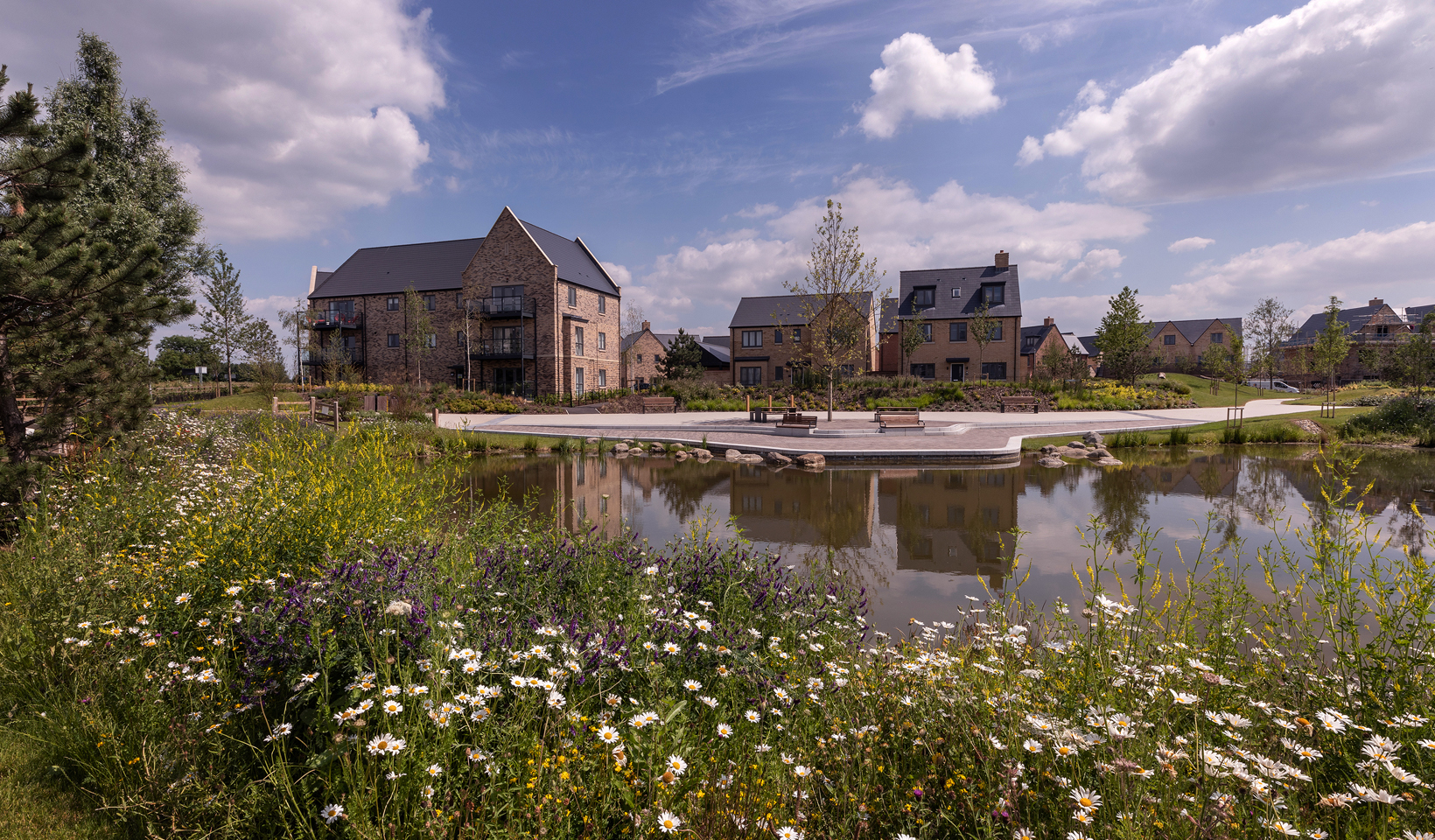 New homes overlooking Bret Pond at Wintringham St Neots