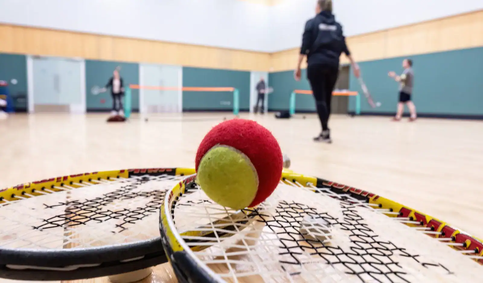 racquets and ball on a court