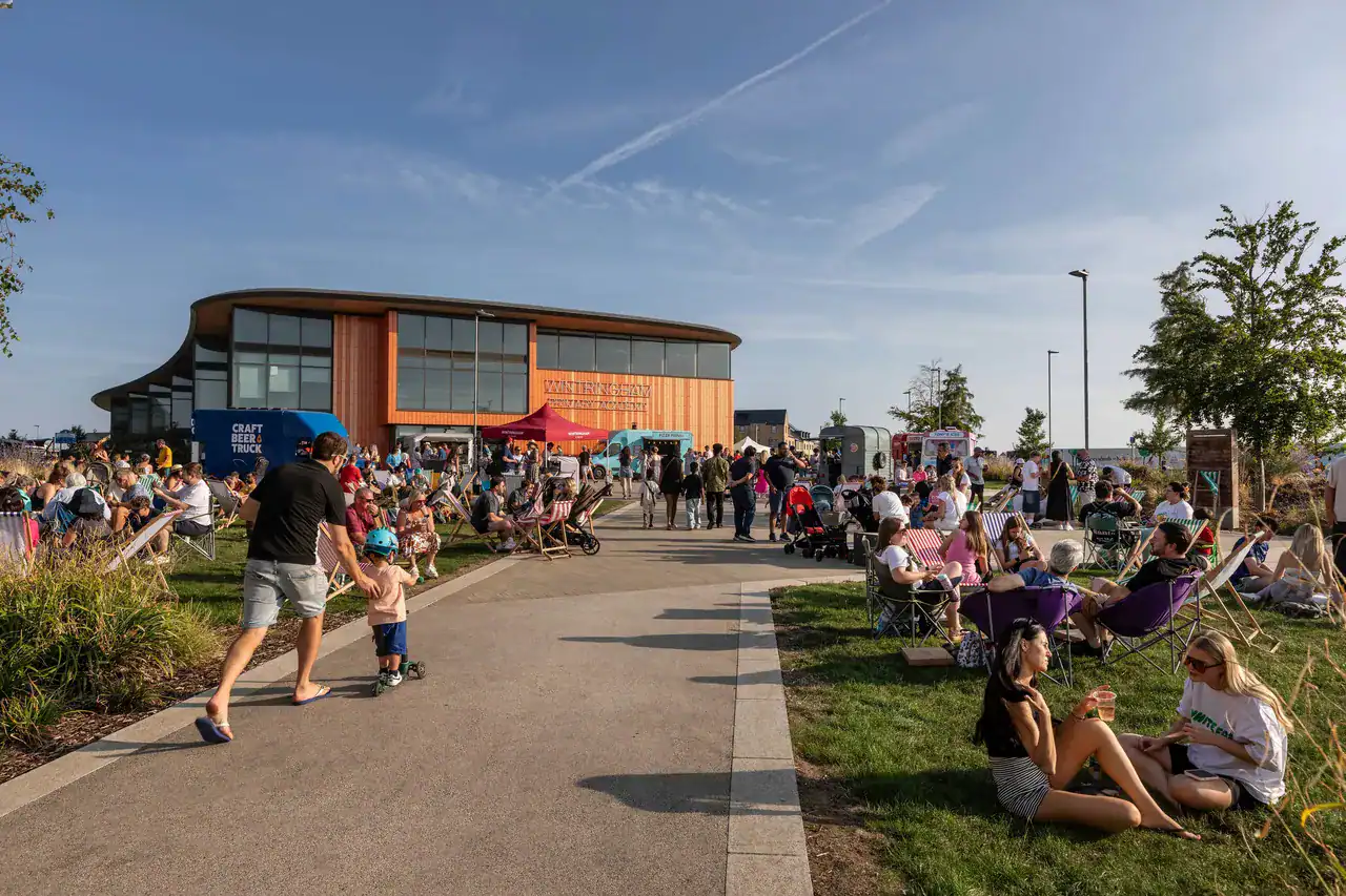 Pop-Up Food event Wintringham showing people sat eating food and vendors selling street food